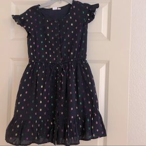 Navy blue girl’s dress with metallic polka dots